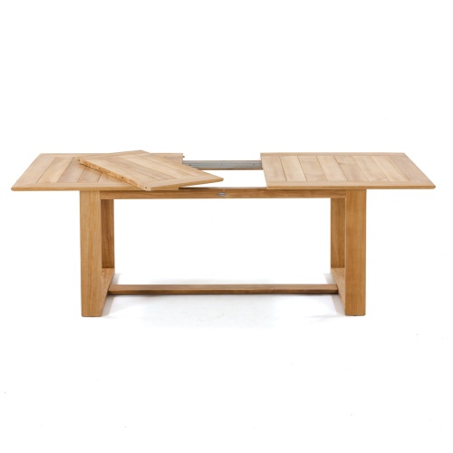70457 Horizon teak dining table showing removable table leaf angled on table top on white background
