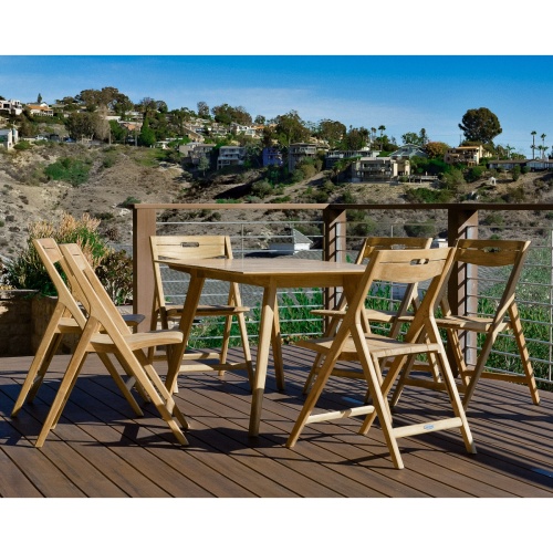 image of 70518 Surf teak 7 piece folding Dining Set angled view on wood deck overlooking homes in background