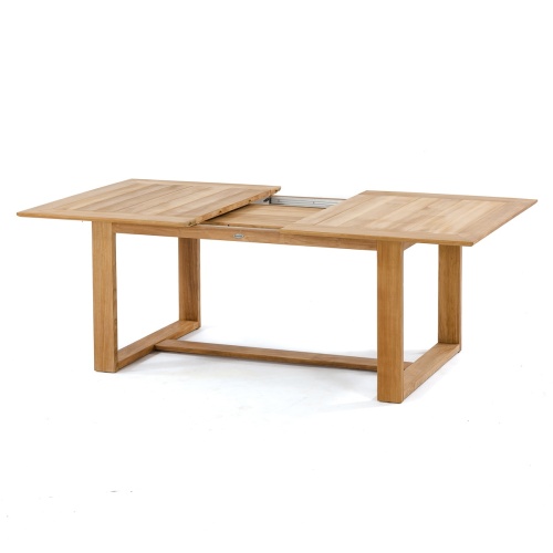 70299 Horizon teak rectangular dining table angled expended showing table leaf stored in table side view on white background