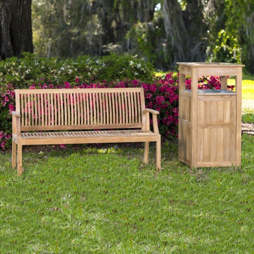 13811 laguna five foot long teak bench on grass in field with trash receptacle right side and flowers in background