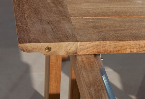 70299 Horizon teak dining table showing closeup view of table extending leaf attachment mechanism