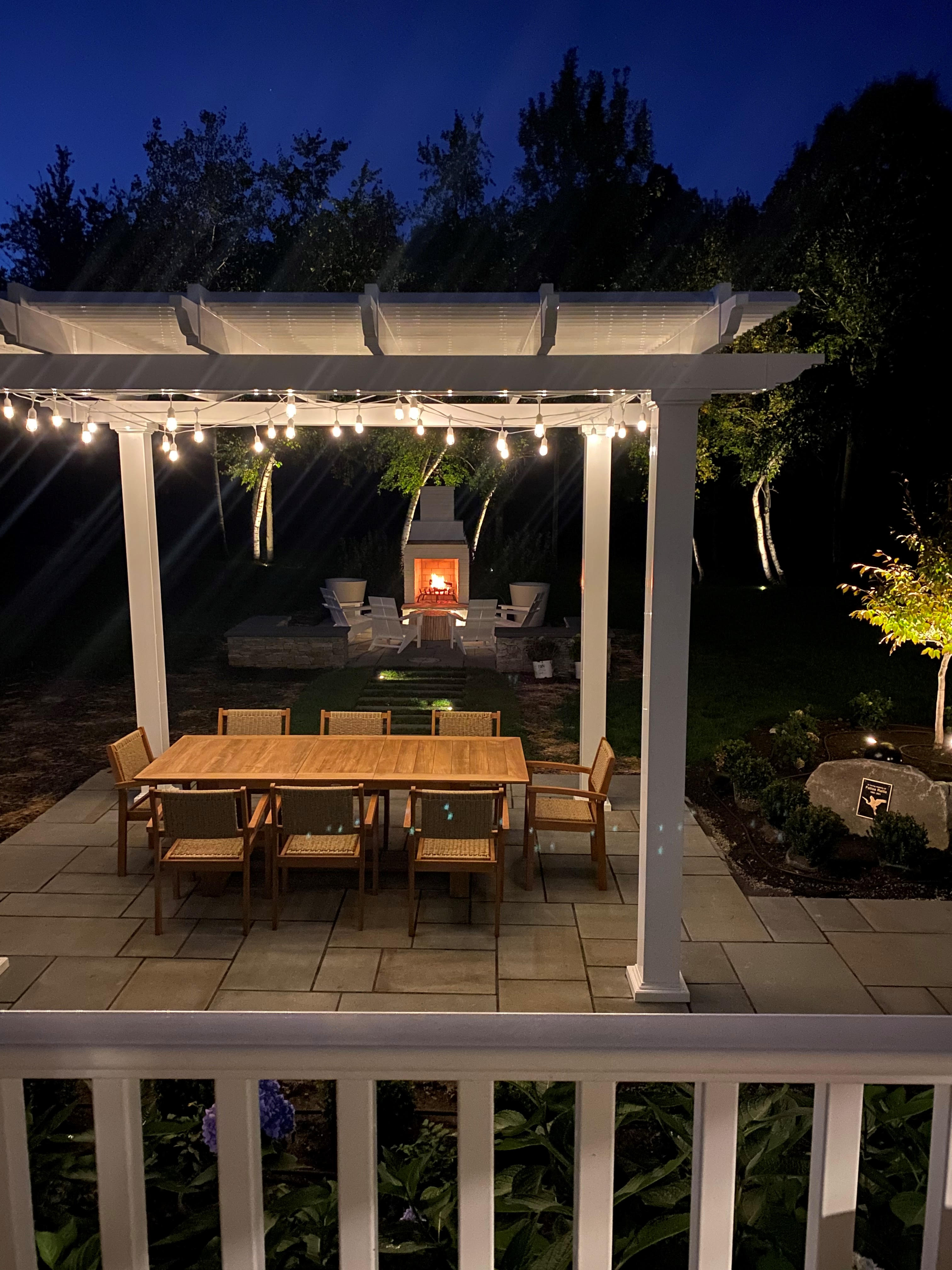 Horizon Table and dining chairs under a pergola gazebo