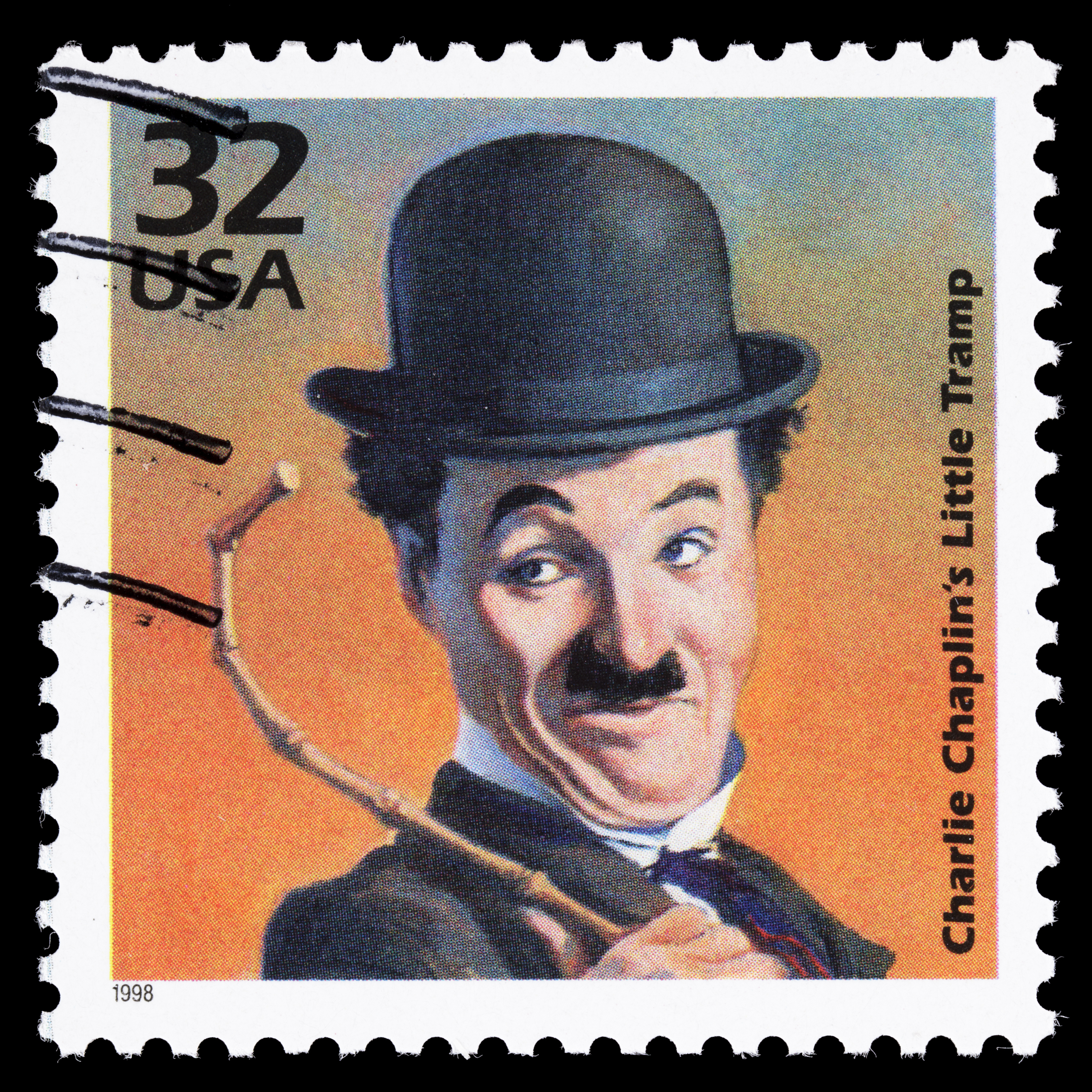 A 1998 USA Postage stamp with an illustration of Charlie Chaplin dressed as his Little Tramp character