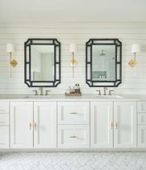 White bathroom counter top with two mirrors
