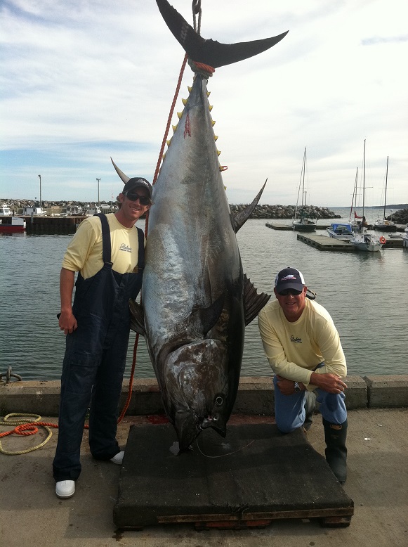 An image of Release Marine’s Co- Founder Sam Peters and President,  Matt Hecht standing beside a prized tuna.