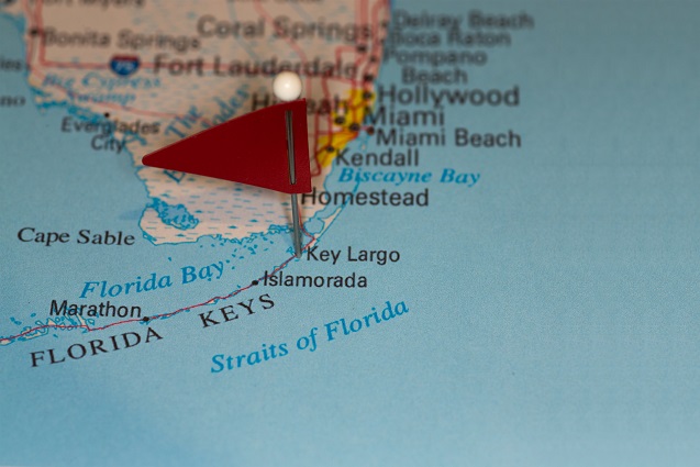 A closeup image of a map of south Florida with a red pinpoint on Key Largo, Florida.