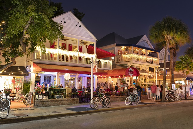 An image of downtown Key West showing shops, restaurants, and bars on Duval Street in Key West, Florida.