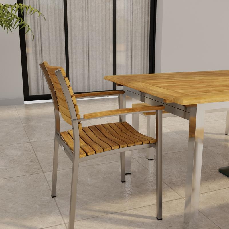 alt="70445 Vogue Bench Dining Set showing partial end view of Stainless Steel and Teak Extension Table and a Dining Chair on a tile patio in front of a glass door of house in background"