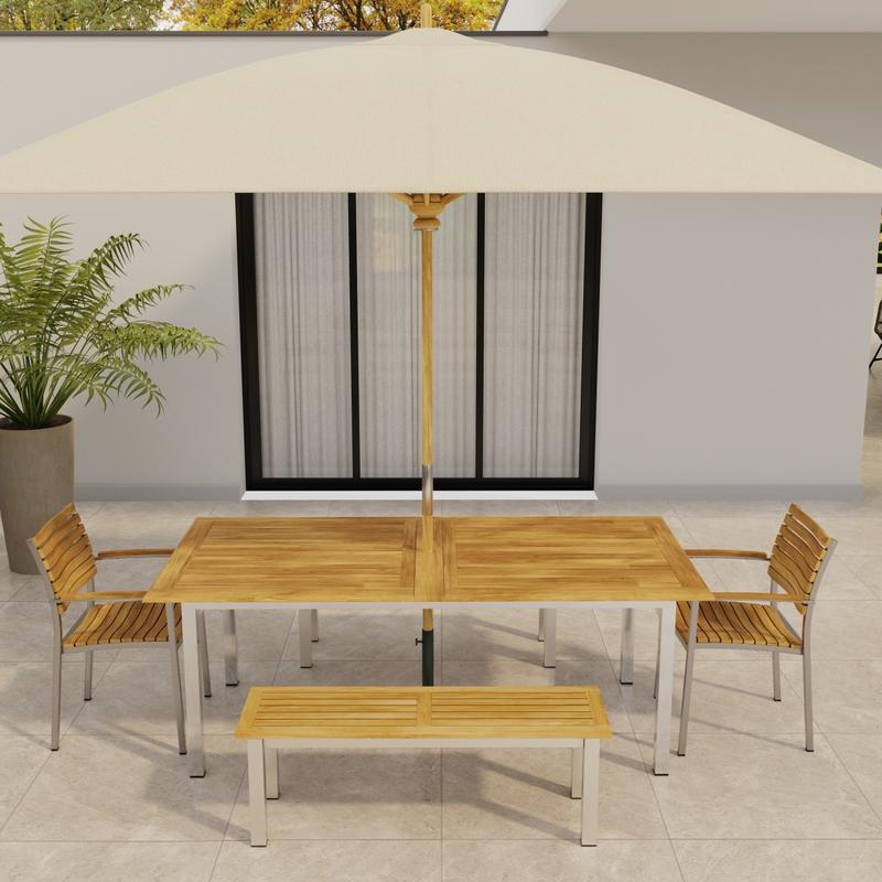 alt="70445 Vogue Bench Dining Set on tile patio with optional umbrella in angled aerial view in front of a glass door of house and potted plant in background"