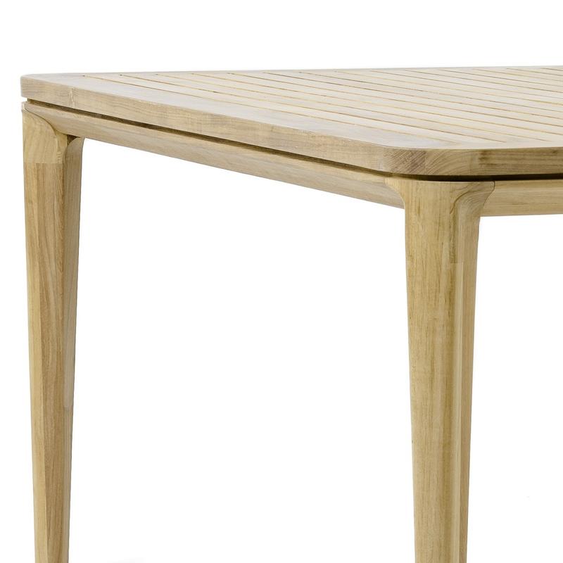 alt="70879 Veranda teak 6 foot square dining table side angled closeup of legs and table top edge on white background"