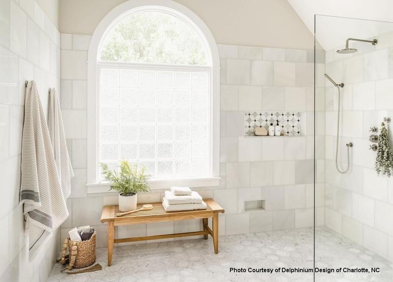 alt="13916 Laguna Teak 5 foot Backless Bench inside a shower with towels on bench"