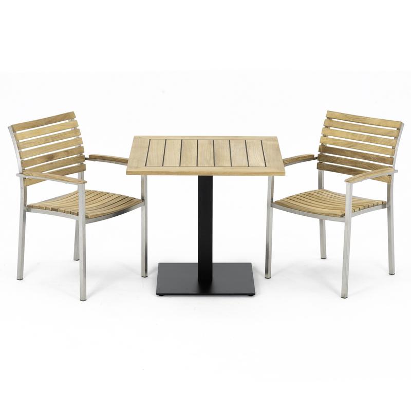 alt="70198 Vogue 3 pc Teak Bistro Set of Teak 32 Inch Square Table and 2 Vogue Teak and Stainless Steel Dining Chairs in angled side view on white background"
