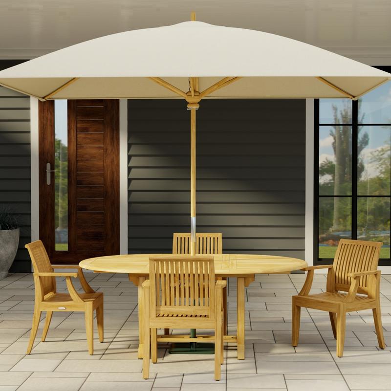 alt="70305 Martinique 5 piece Dining Set with optional rectangular umbrella in side view on stone patio with a house and door and window in the background"