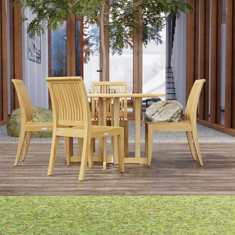 alt="70732 Barbuda Laguna 5 pc Teak Dining Set on patio with trees and landscape rocks and french doors and windows of house in the background"