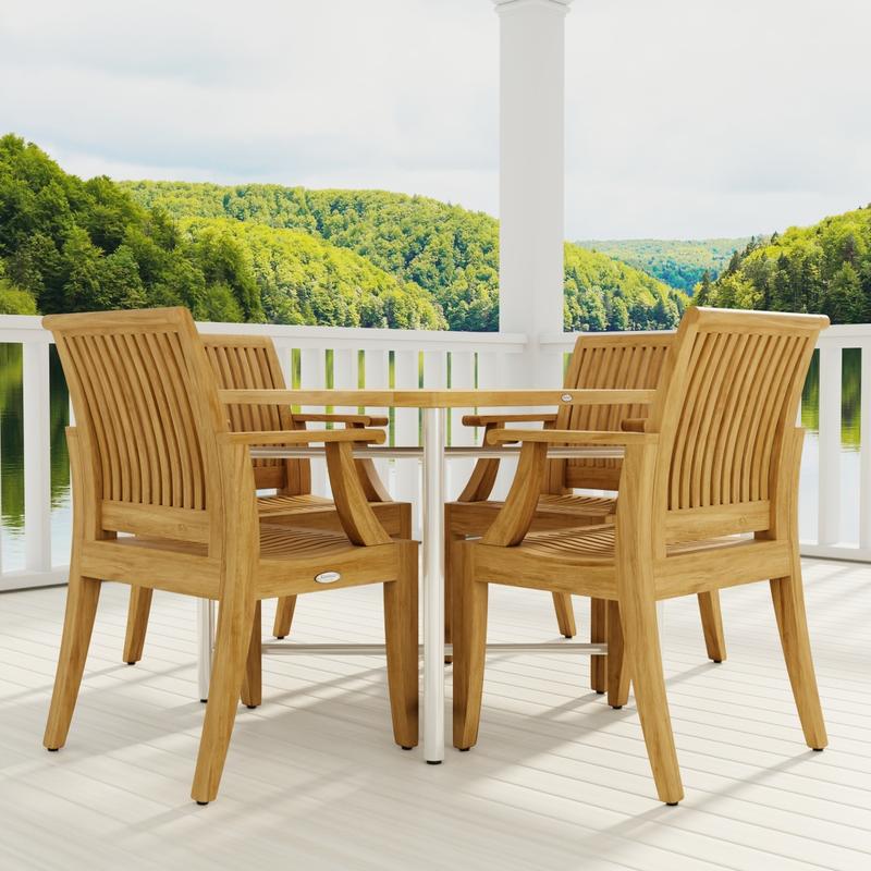 alt="70598 Odyssey Laguna Dining Chair Set of Odyssey Table and 4 Laguna Dining Chairs corner view on patio with railing and column in background overlooking hillside "