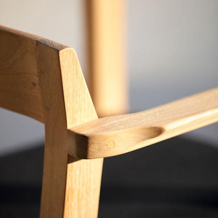 alt="12901 Horizon teak Dining Armchair right side closeup of arm and back of armchair"