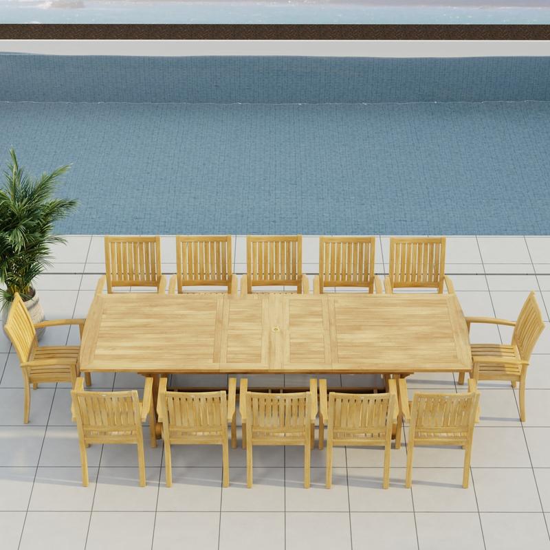 alt="70757 Sussex Veranda 13 pc Teak Dining Set of Grand Veranda Rectangular Extending Dining Table and 12 Sussex Stacking Chairs in angled aerial side view on patio in front of a pool "