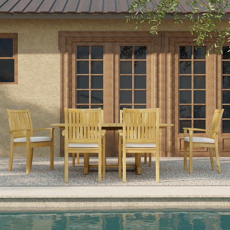 alt="70214 Martinique Sussex Teak 7 pc Dining Set with optional seat cushions in side view next to pool with French doors of house in background"