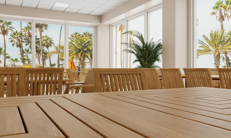 alt="15815A  Pyramid 36 inch Rectangular Table showing closeup of table top with other dining sets in a hospitality setting with large windows and trees in background"