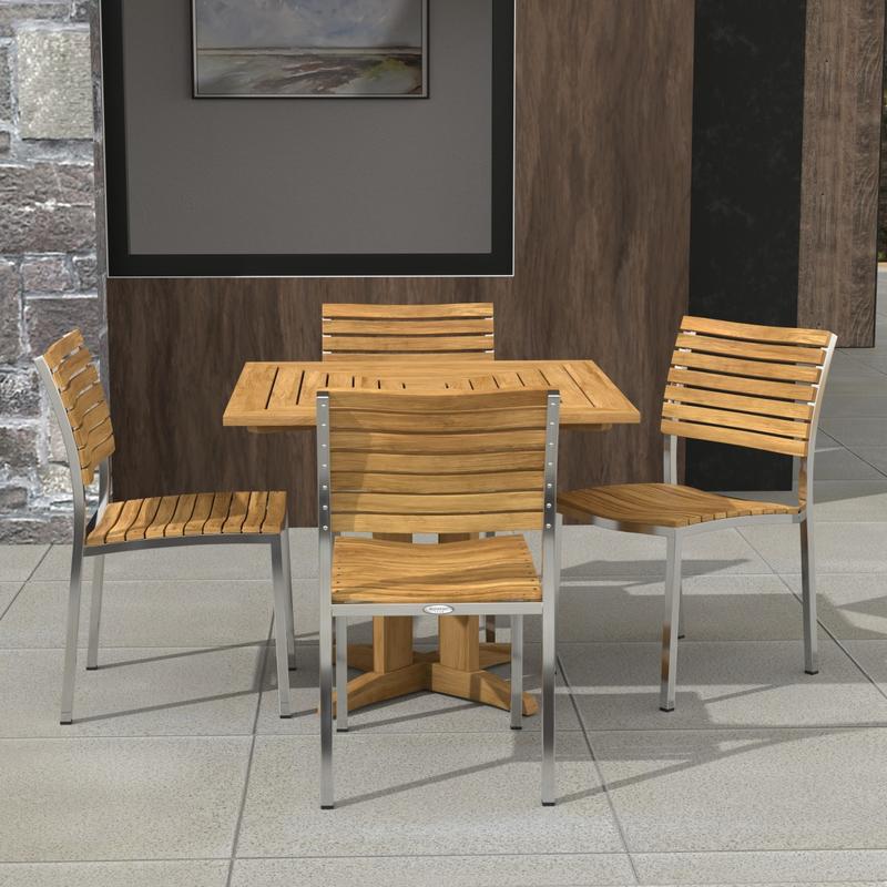alt="70574 Vogue Pyramid 5 pc Cafe Set of Pyramid Dining Table and 4 Vogue Side Chairs angled aerial view on tiled patio with wall and window in the background"