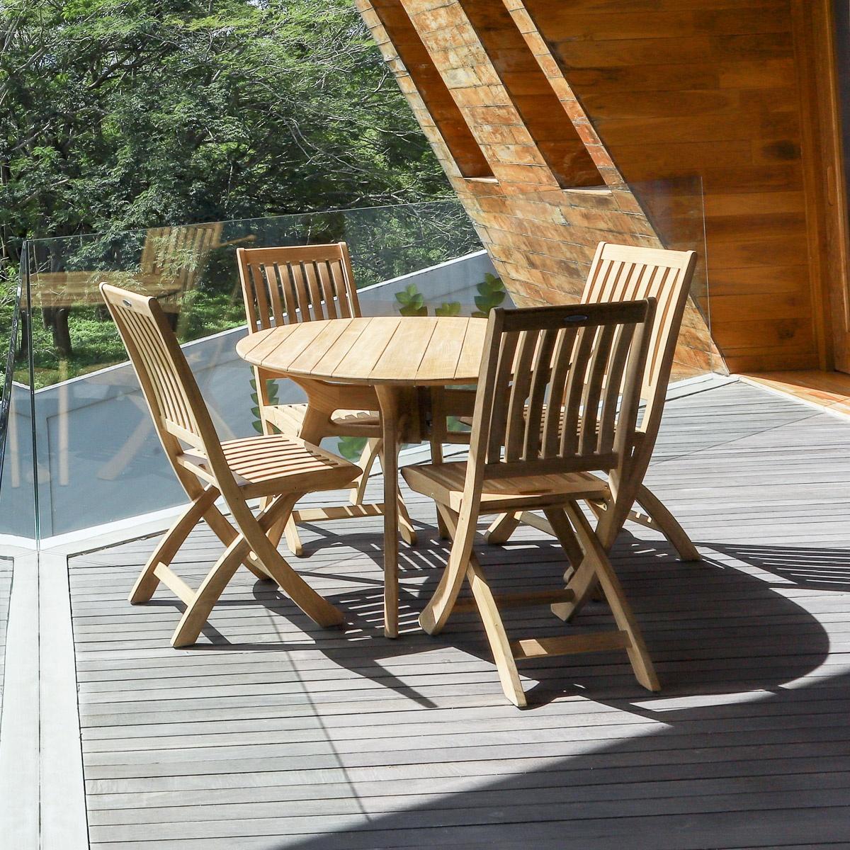 70825 Barbuda Surf 4 piece Dining Set of 4 folding side chairs and round 42 inch dining table on a wooden deck overlooking trees