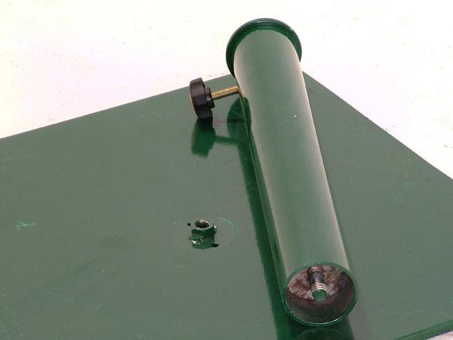 alt="57801 Parasol Steel Base in green color closeup angled view showing umbrella pole holder laying on steel base on white background"