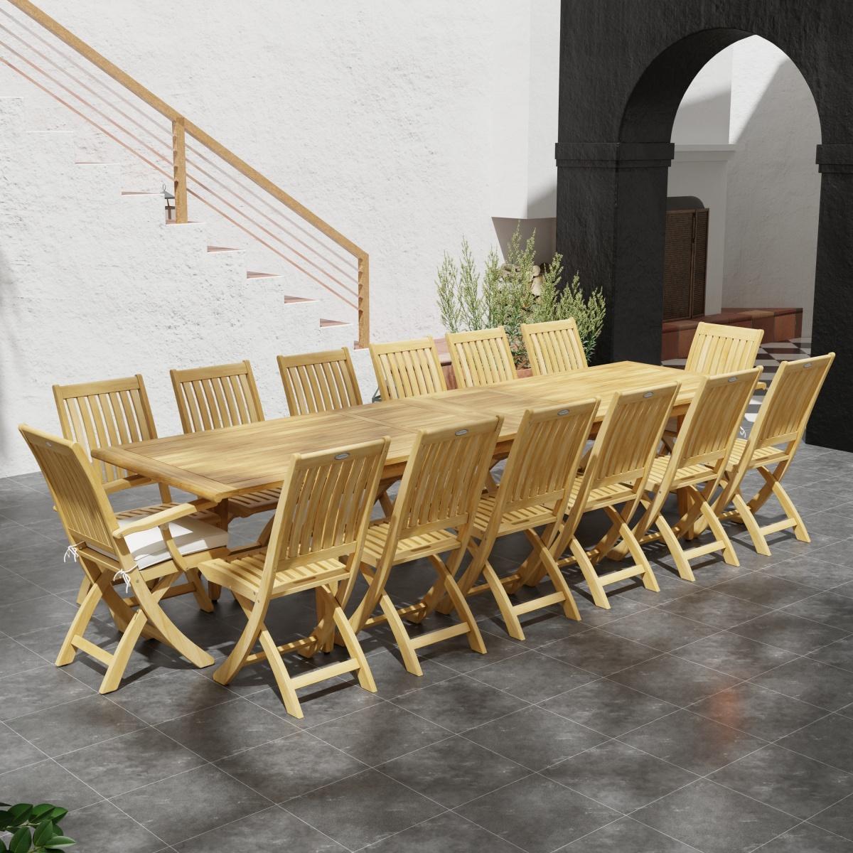 70351 Laguna Barbuda 15 pc Dining Set of 14 dining armchair and rectangular 11 foot extendable dining table angled view on patio next to staircase with archway and plants in background