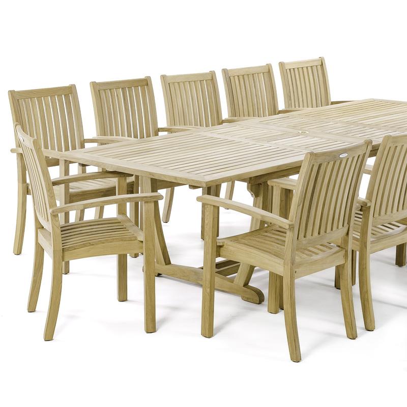 alt="70757 Sussex Veranda teak 13 piece dining set partial closeup view of 8 Sussex Stacking Chairs and Grand Veranda Rectangular Extension Dining Table on white background"