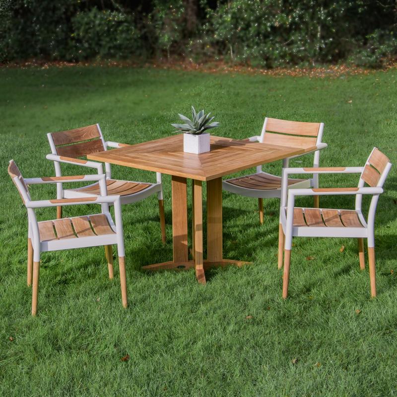 alt="70452 Bloom Pyramid Bistro Dining Set of 4 Bloom teak and powder coated aluminum dining chairs and Pyramid 36 inch square teak dining table with potted plant on grass in background"