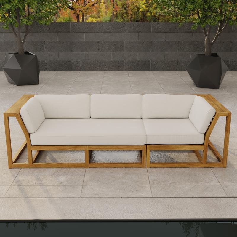 alt="70277 Maya Deep Seating Sofa of Maya Right Side Sofa Sectional and Corner Sectional in angled front view on patio facing a pool with fence and trees in background"