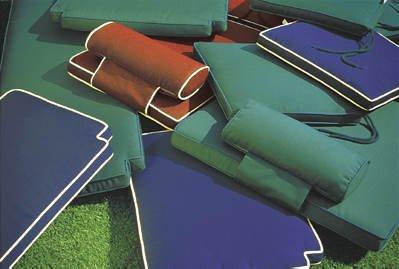 alt="72569MTO Navy Blue color cushions and neckrolls  lying on green Terf grass"