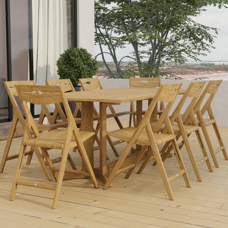 alt="70464 Surf Pyramid Teak Dining Set for 8 angled end view on outdoor terrace in front of a glass door and potted with trees and ocean in background "