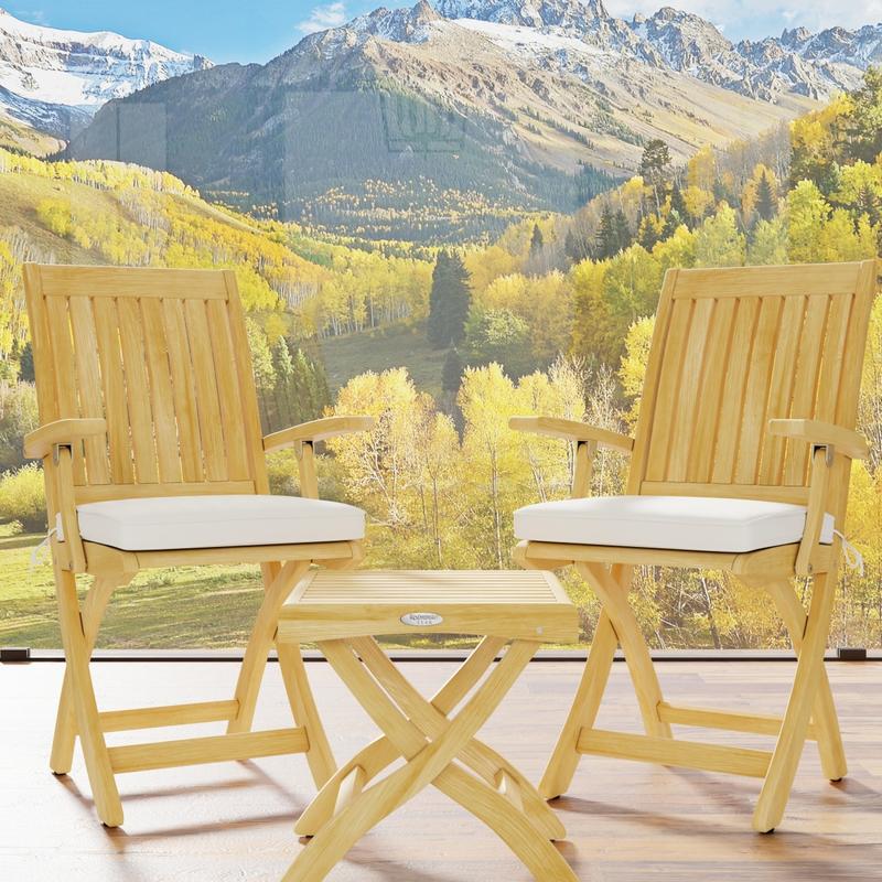alt="70798 Barbuda 3 piece Teak Chat Set of 2 Barbuda Folding Armchairs and a folding teak side table ottoman on outdoor deck with mountain and wooded views in background"