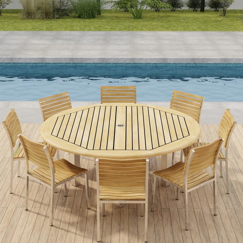 alt="70444 Vogue Teak Dining Set for 8 showing Vogue Teak and Stainless Steel 6 ft Round Dining Table and 8 Dining Chairs in angled table top view with a pool in background "