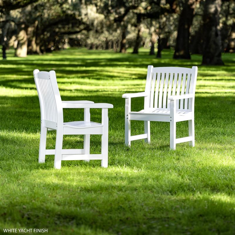 alt="70891 Veranda Teak Dining Armchair with Poly Finish on Green Grass with Trees in the background by Meadow"