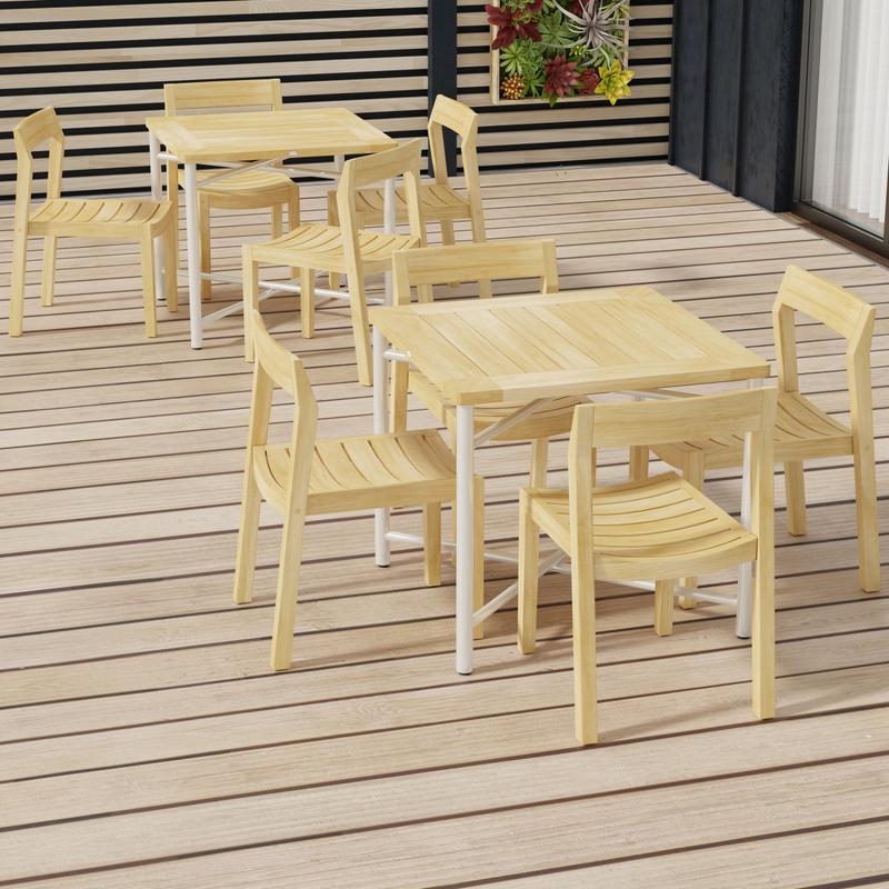 alt="70596 Odyssey Horizon Teak and 316L Stainless Steel Dining Set showing 2 sets in angled aerial view on wood deck with privacy wall with succulents in the background"