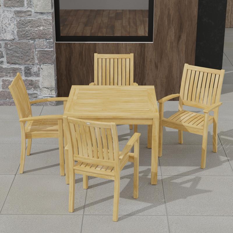 alt="70210 Sussex 5 pc Teak Dining Set of Square Bistro Teak Table and 4 Sussex Armchairs in angled view of table top on patio with  house and windows in the background"