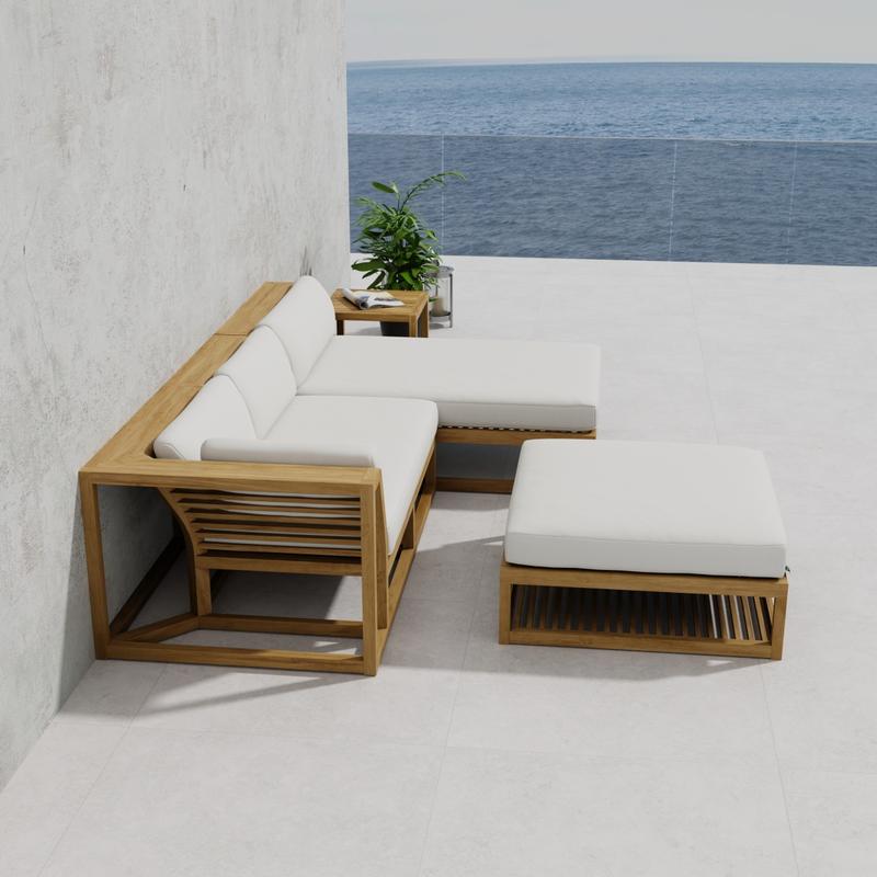 alt="70658 Maya 4pc Lounge Set of Maya Right Side and Daybed Sectionals and Ottoman Coffee Table and Side Table  on patio against a wall in side view with ocean in background"