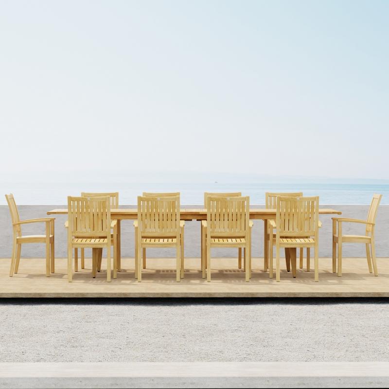 alt="70812 Laguna Sussex teak 11 piece Dining Set of 10 teak armchairs and teak 11 foot extendable dining table side view on terrace with ocean background"