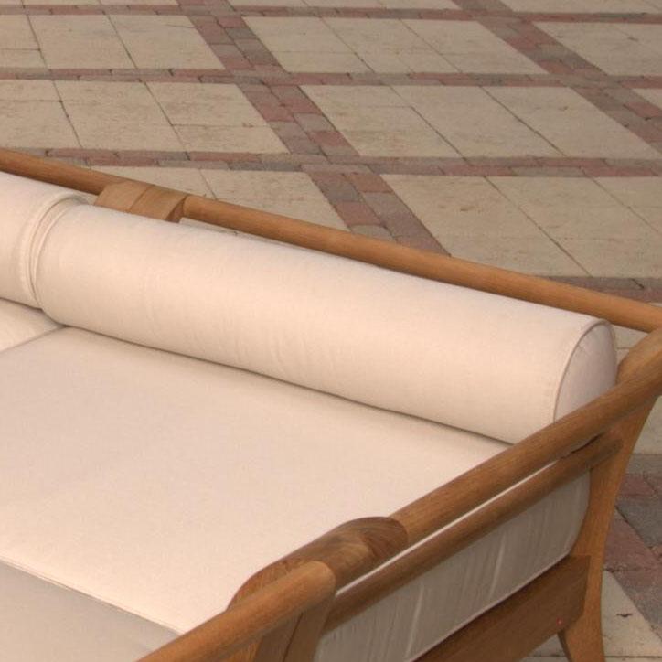 72395MTO Aman Dais 34 inch Corner Bolster Pillow on Aman Dais teak corner frame on paver patio