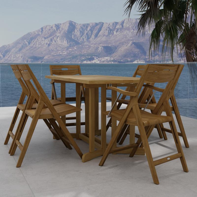 alt="70146 Surf Nevis Teak 7 pc Dining Set of Nevis Dining Table and 2 Surf Dining Chairs and 4 Surf Side Chairs end view on tile patio overlooking the ocean and land mass in background"