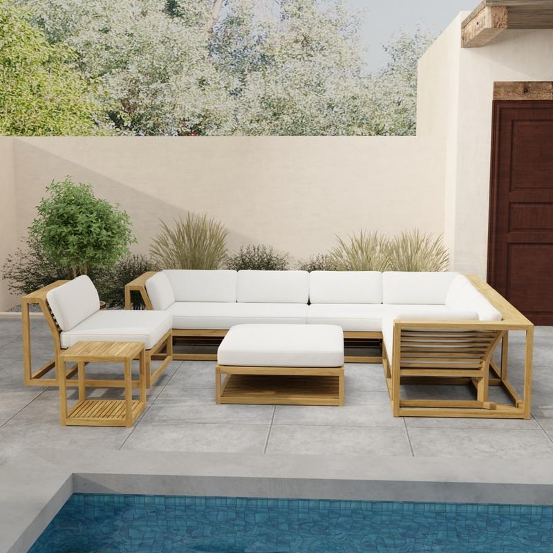 alt="70273 Maya 6pc Sectional Set in front view on patio overlooking a pool with landscaping and potted plants against privacy wall and a door of house in background "