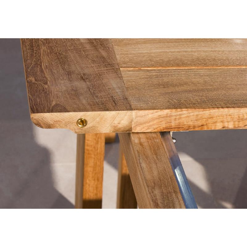 alt="70299 Horizon teak dining table showing closeup view of table expanding mechanism on concrete terrace"