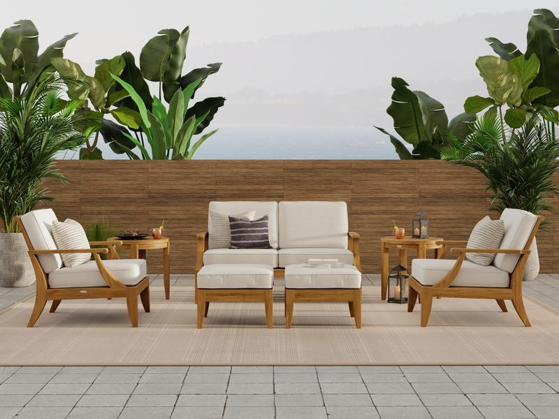 alt="70877 Laguna 7 piece teak Love Seat Set on patio with privacy wall and tropical trees in background"