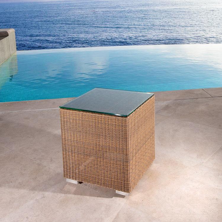 alt="31007DP Malaga Wicker Side Table on concrete patio overlooking pool and ocean"