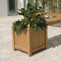alt="18109 square planter box angled view on concrete patio with shrubs in background"