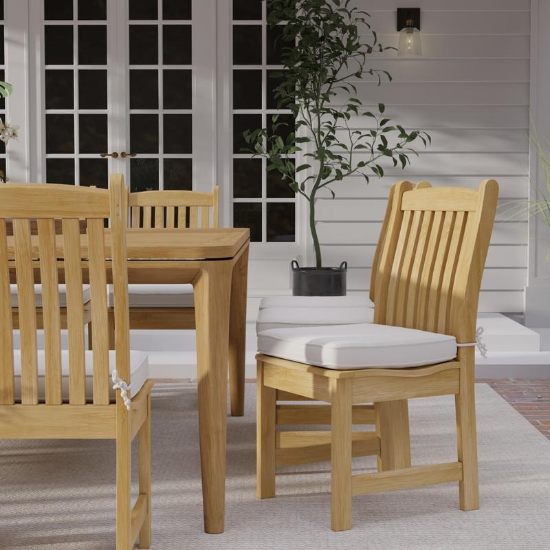 alt="11315 Veranda Teak Side Chair with optional seat cushion on patio with wall and french doors in the background"