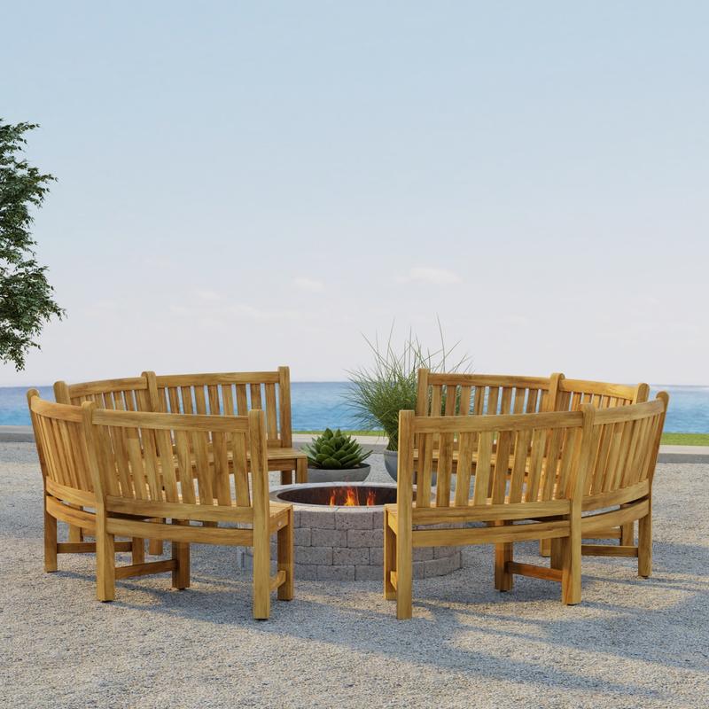 alt="70657 Buckingham Bench Set of 4 around a firepit on outdoor patio next to 2 potted plants in angled side view with the ocean and blue sky in the background"