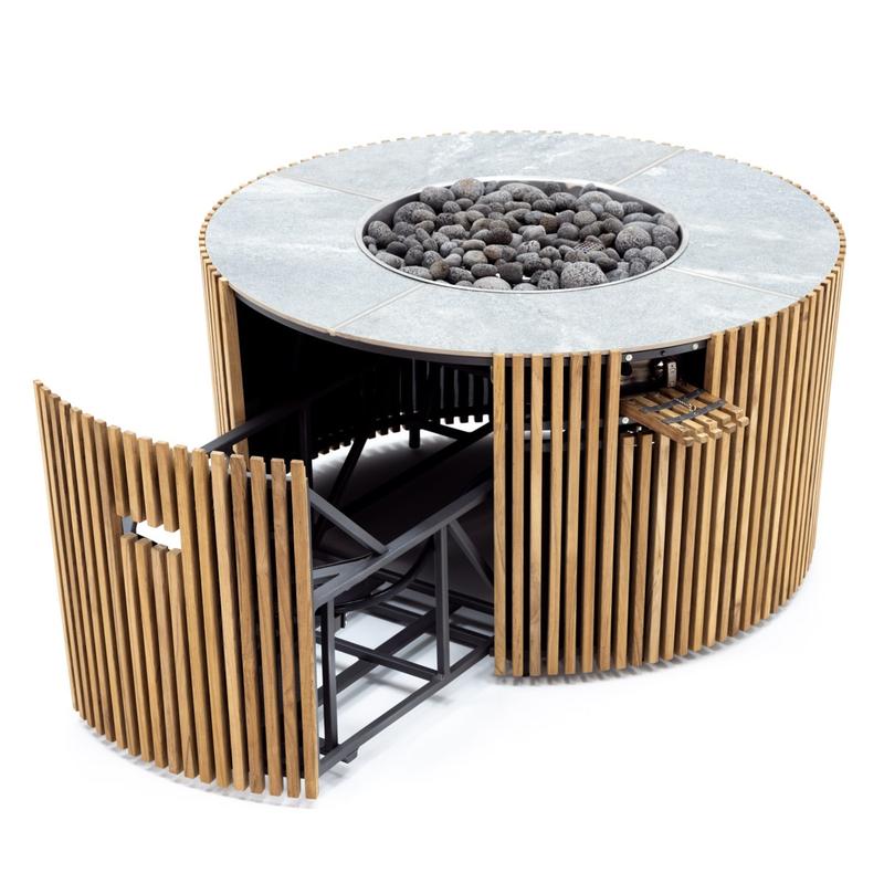 alt="14100 Agora Round 40 inch table angled top view showing slatted teak exterior with ceramic slate top and fire bowl and opened propane tank storage hook up area on white background "
