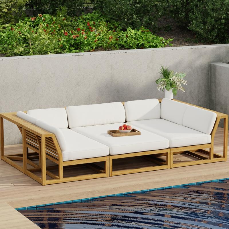 alt="70274 Maya 3pc Daybed on patio in aerial angled side view with tray of fruit on middle daybed section facing a pool next to a potted plant with privacy wall with shrubs and trees in background"